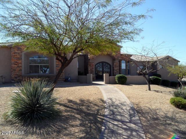 35401 N Via Tramonto St, Phoenix, AZ 85086 - view of front of house featuring stucco siding and stone siding