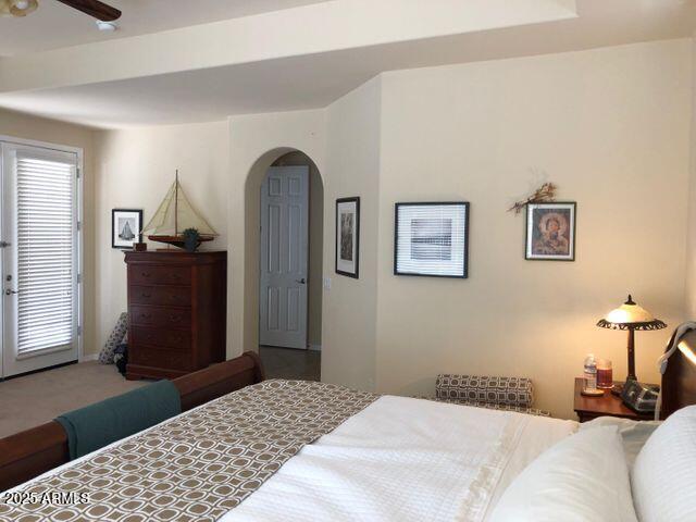 35401 N Via Tramonto St, Phoenix, AZ 85086 - bedroom featuring arched walkways and carpet floors