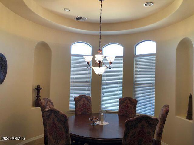 35401 N Via Tramonto St, Phoenix, AZ 85086 - dining area with a chandelier, arched walkways, and recessed lighting