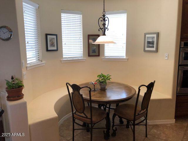 35401 N Via Tramonto St, Phoenix, AZ 85086 - tiled dining room with baseboards