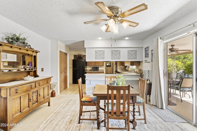dining room with a textured ceiling, ceiling fan, light colored carpet, and recessed lighting