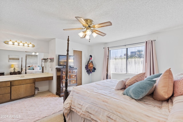bedroom featuring ceiling fan, carpet, and a textured ceiling