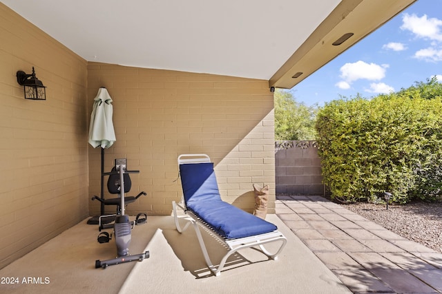 view of patio / terrace featuring fence