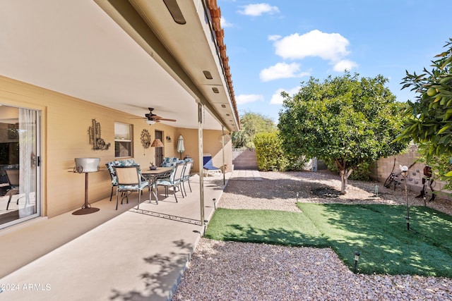 view of patio / terrace with a fenced backyard and a ceiling fan