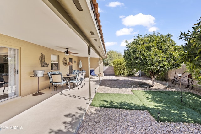 view of patio / terrace with a ceiling fan and a fenced backyard