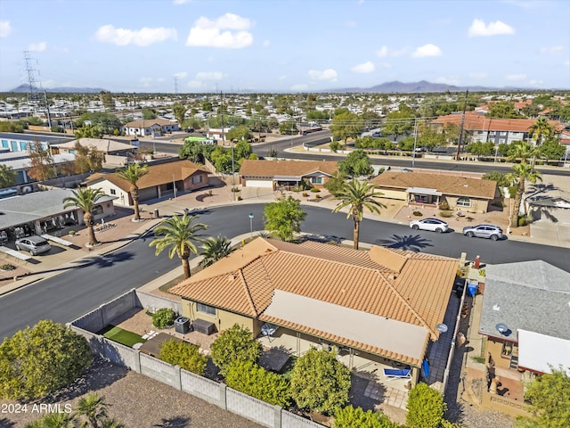 drone / aerial view with a residential view and a mountain view
