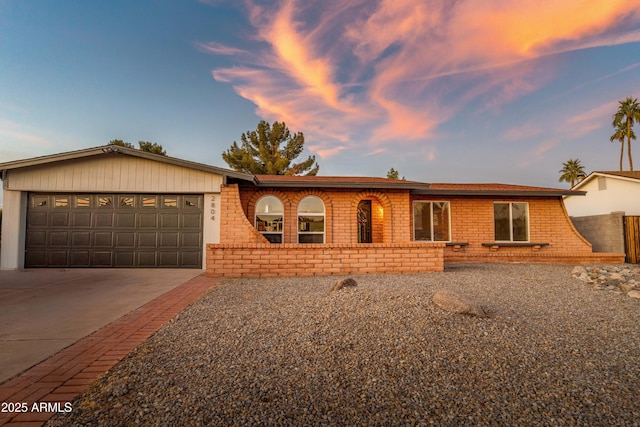 single story home featuring a garage