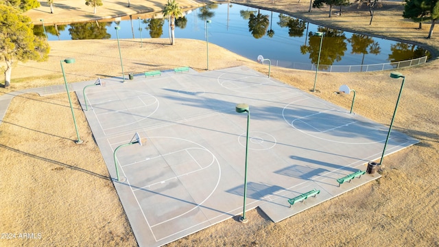 view of sport court featuring a water view