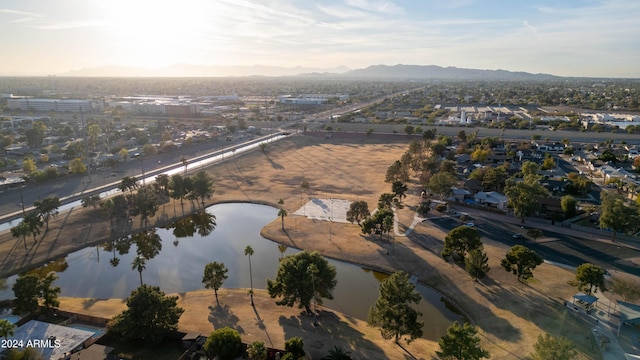 drone / aerial view featuring a water and mountain view