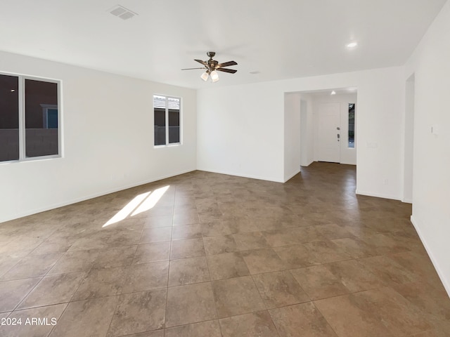 unfurnished room featuring ceiling fan