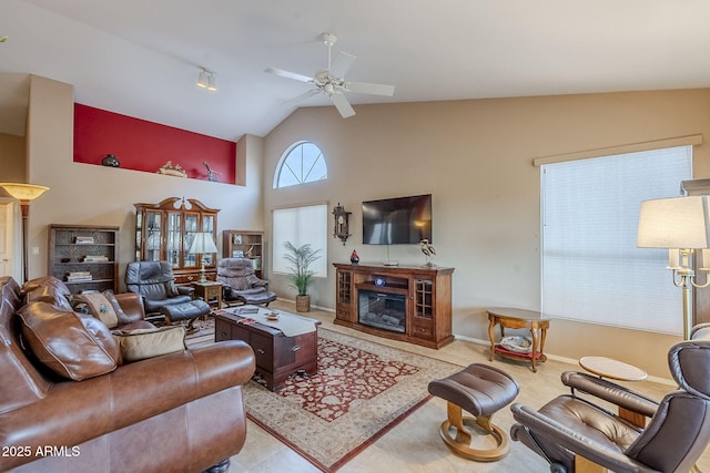 living room with ceiling fan and lofted ceiling