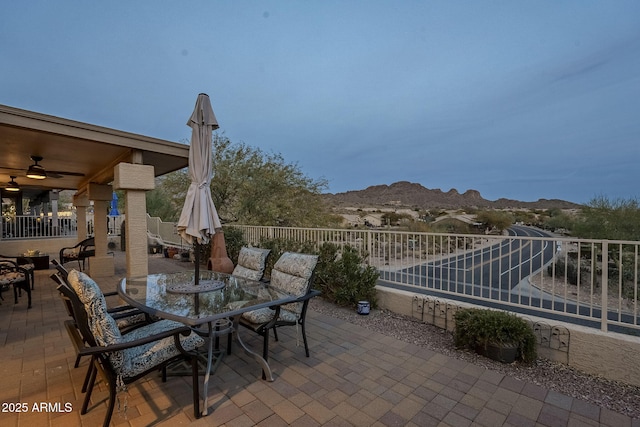 view of patio / terrace featuring a mountain view and ceiling fan