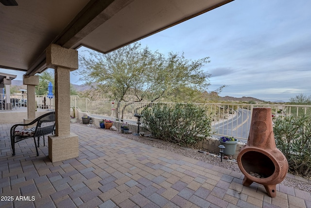 view of patio / terrace featuring a mountain view