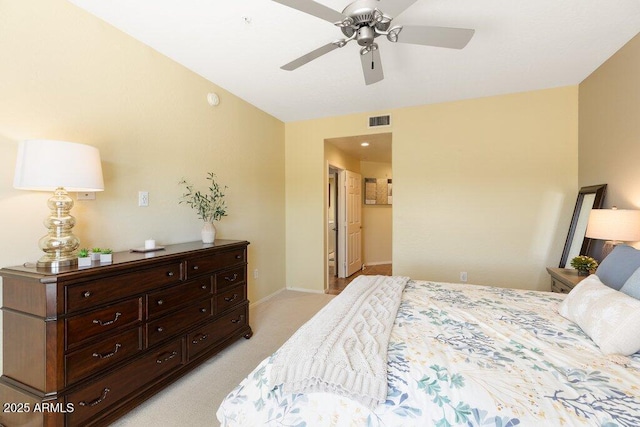 bedroom featuring light carpet, a ceiling fan, visible vents, and baseboards