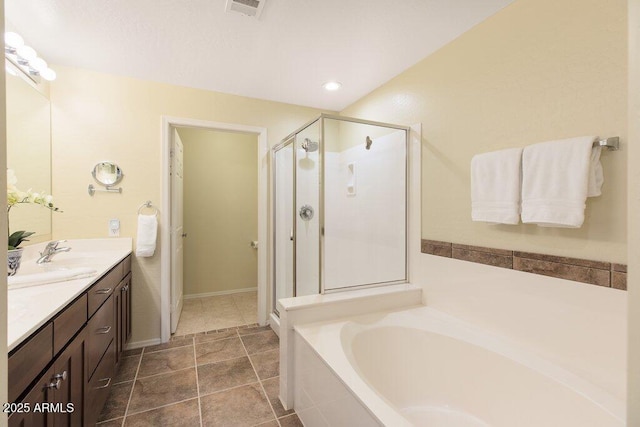 bathroom with a garden tub, visible vents, a stall shower, vanity, and tile patterned floors