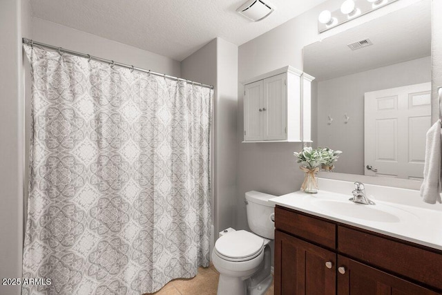 full bathroom with visible vents, vanity, toilet, and a textured ceiling