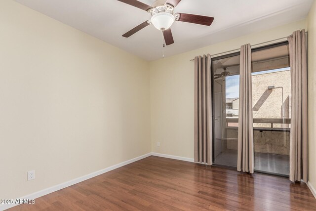 spare room with dark wood-style floors, ceiling fan, and baseboards