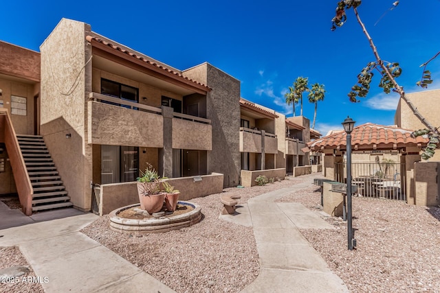 view of property's community featuring stairway