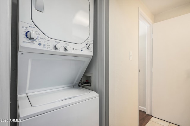 washroom with laundry area and stacked washing maching and dryer