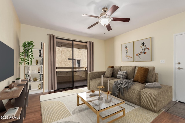 living room featuring wood finished floors and ceiling fan