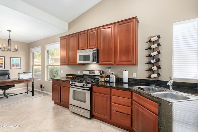 kitchen featuring stainless steel appliances, vaulted ceiling, sink, an inviting chandelier, and hanging light fixtures