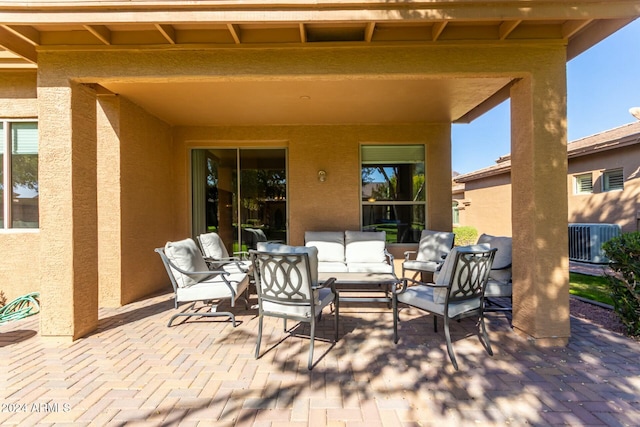 view of patio with outdoor lounge area and central AC unit