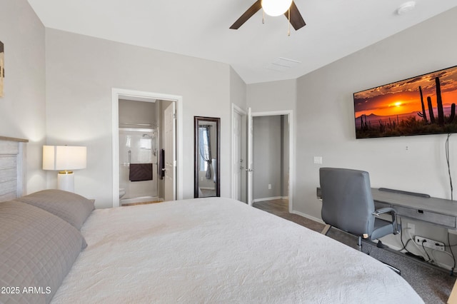 carpeted bedroom featuring baseboards, connected bathroom, and a ceiling fan