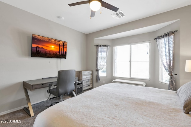 carpeted bedroom featuring baseboards and ceiling fan