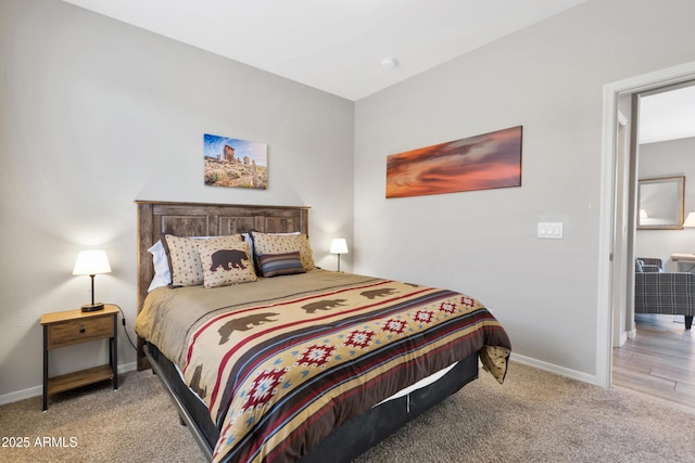 bedroom with baseboards and carpet floors