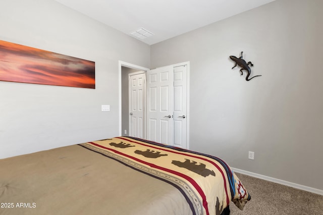 carpeted bedroom featuring baseboards