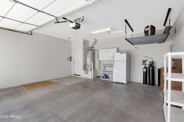 garage featuring freestanding refrigerator, gas water heater, and a garage door opener