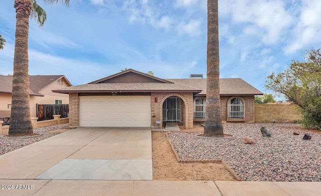 single story home featuring a garage