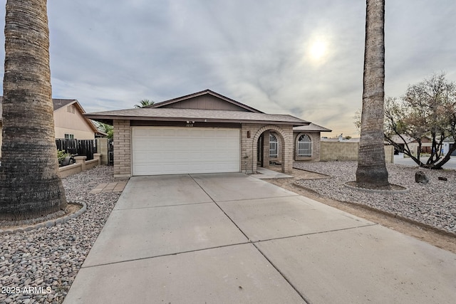 single story home with a garage