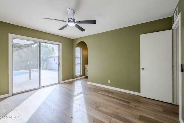 unfurnished room featuring ceiling fan and light wood-type flooring