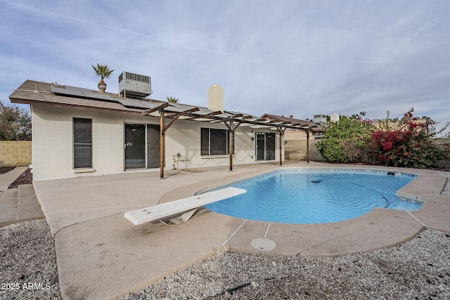 view of swimming pool featuring central air condition unit, a pergola, a diving board, and a patio