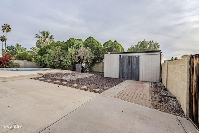 view of outdoor structure featuring a fenced in pool