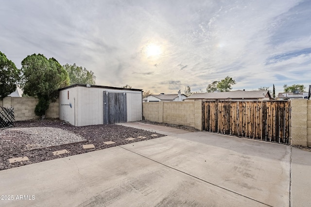 view of patio featuring a shed