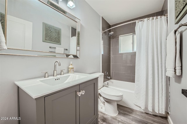 full bathroom with shower / bathtub combination with curtain, vanity, toilet, and wood-type flooring