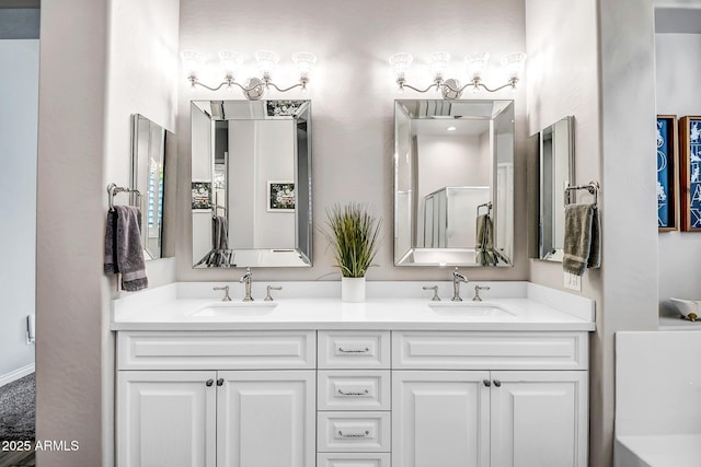 bathroom featuring vanity and an enclosed shower