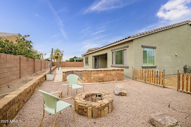 exterior space featuring an outdoor fire pit