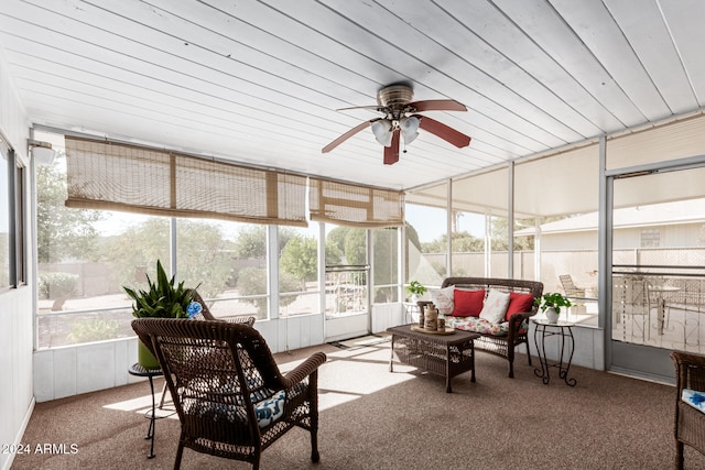 sunroom / solarium with wooden ceiling, ceiling fan, and a healthy amount of sunlight