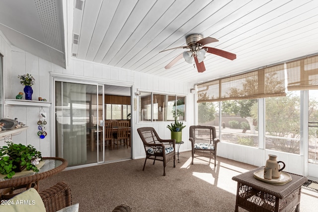 sunroom with ceiling fan and wood ceiling