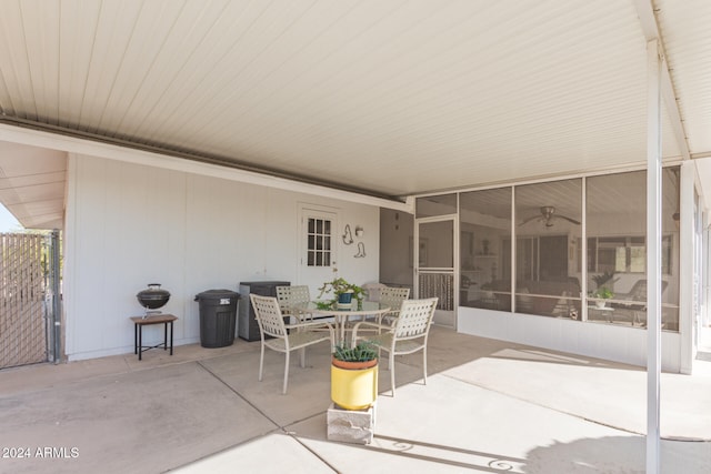 view of patio featuring a sunroom