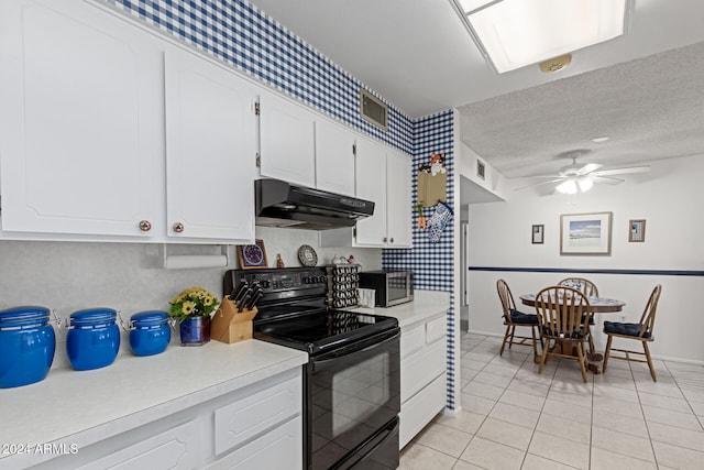 kitchen with black electric range oven, white cabinets, ceiling fan, light tile patterned floors, and a textured ceiling