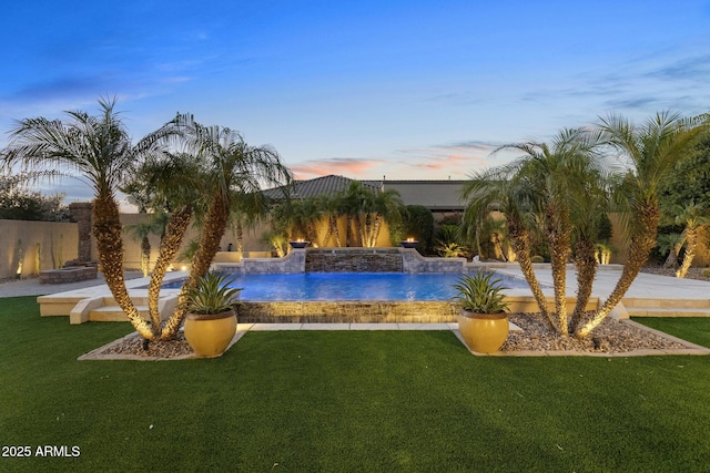 6918 E Ivyglen St, Mesa, AZ 85207 - pool at dusk with an outdoor pool