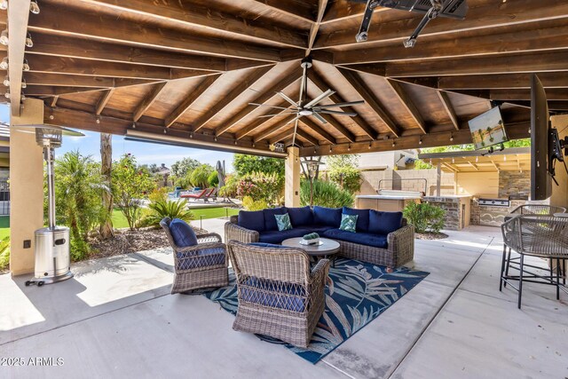 6918 E Ivyglen St, Mesa, AZ 85207 - view of patio / terrace with a gazebo, an outdoor living space, ceiling fan, and exterior bar