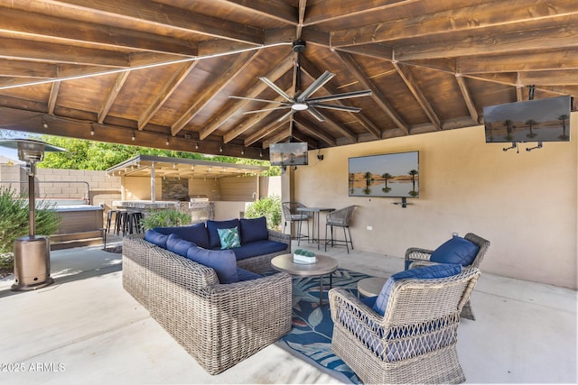 6918 E Ivyglen St, Mesa, AZ 85207 - view of patio / terrace with outdoor lounge area, a ceiling fan, exterior bar, and an outdoor kitchen