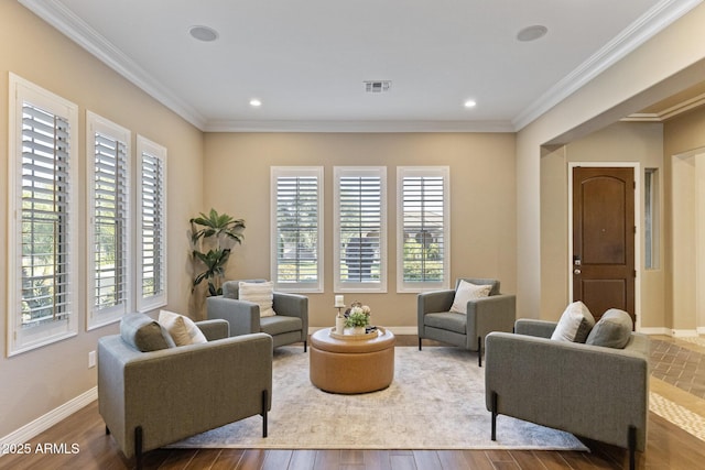 6918 E Ivyglen St, Mesa, AZ 85207 - living area featuring healthy amount of natural light, wood finished floors, ornamental molding, baseboards, and recessed lighting