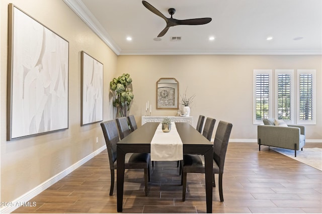 6918 E Ivyglen St, Mesa, AZ 85207 - dining space with ornamental molding, wood finished floors, ceiling fan, baseboards, and recessed lighting