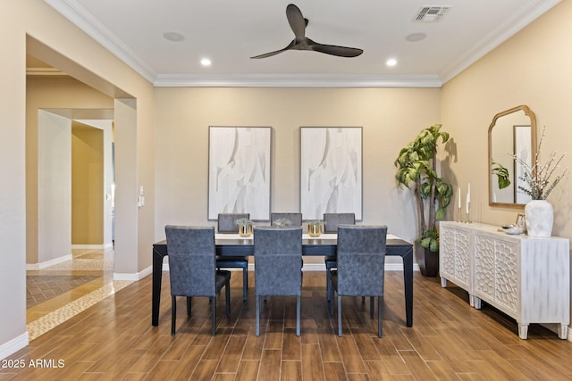 6918 E Ivyglen St, Mesa, AZ 85207 - dining space with wood tiled floors, crown molding, a ceiling fan, baseboards, and recessed lighting